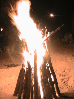 Warmth of Bahamas people doing a bon fire.