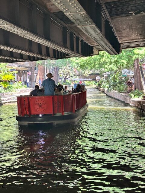 What to do at San Antonio River Walk includes a river boat ride.