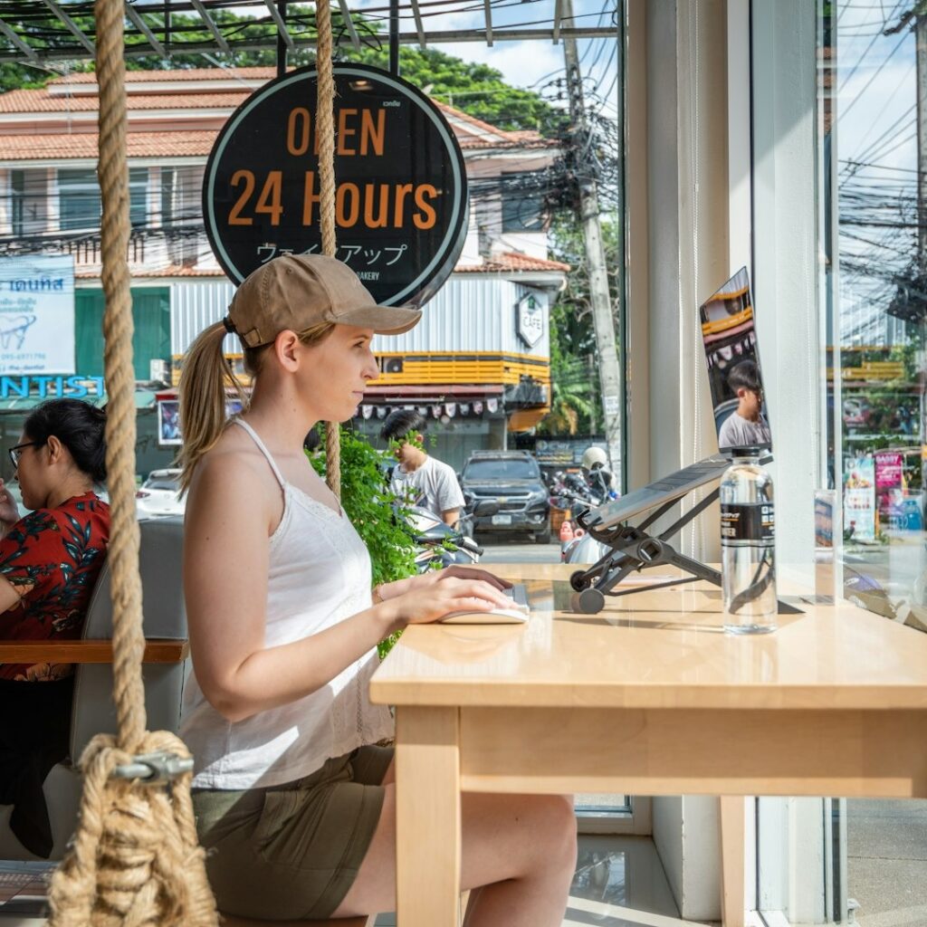 A digital nomad at work in a cafe.