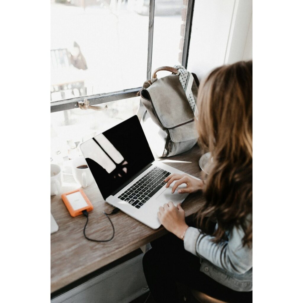 A digital nomad woking on computer.