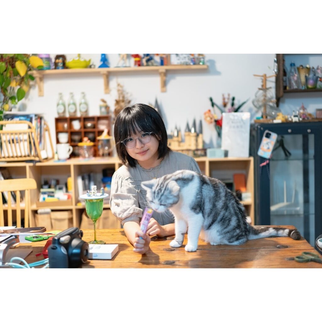 A girl having quality time with her pet cat.