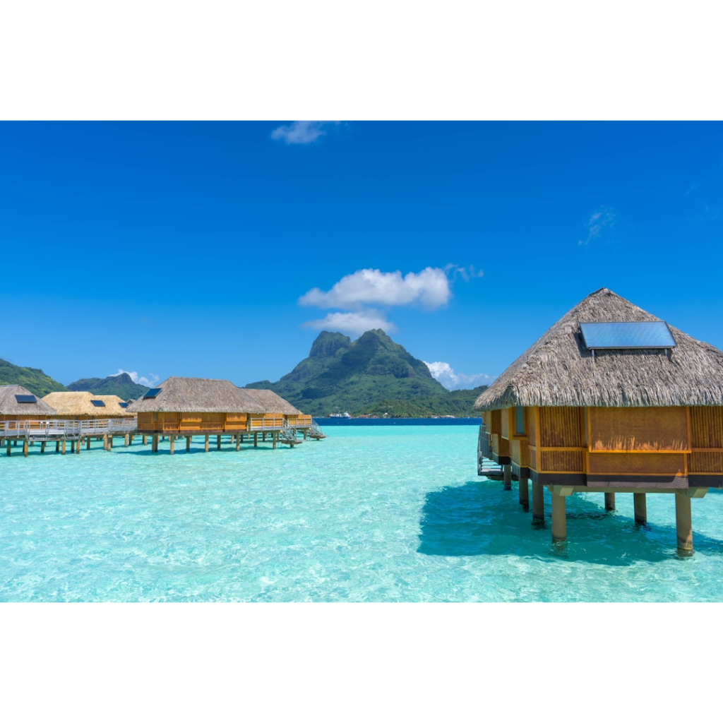 Luxury Travel in Bora Bora includes Bungalows over the ocean. 